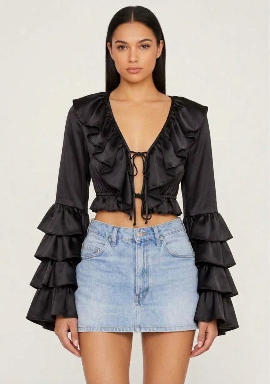 Black silk satin ruffle crop top with ruffled plunge neckline and front tie by Vanity Couture
