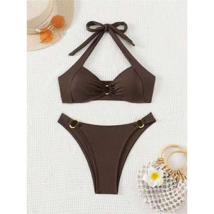 Brown bikini set with matching accessories on a white background