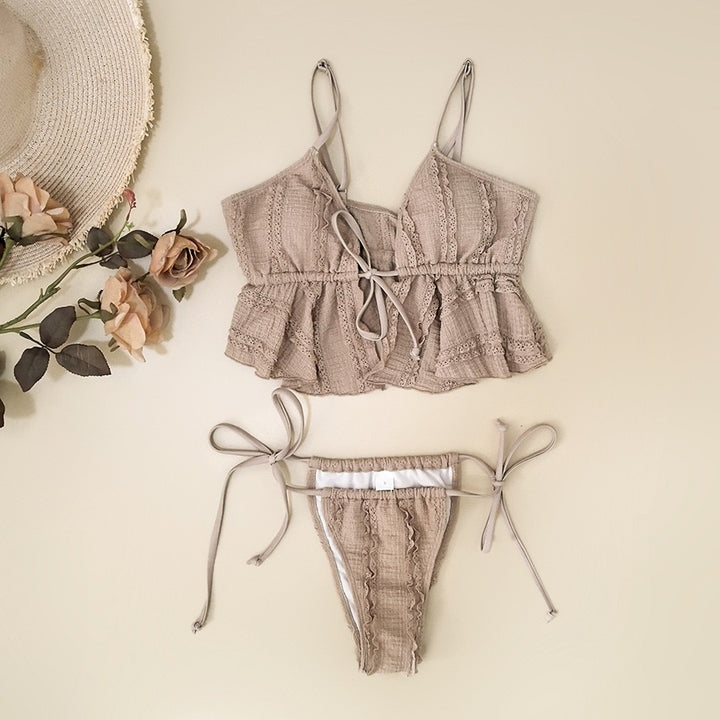 Beige bikini set with matching hat and flowers on a beige background
